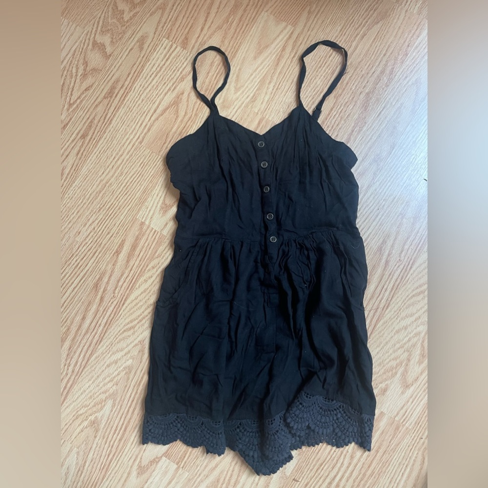 Black romper with lace crocheted trim